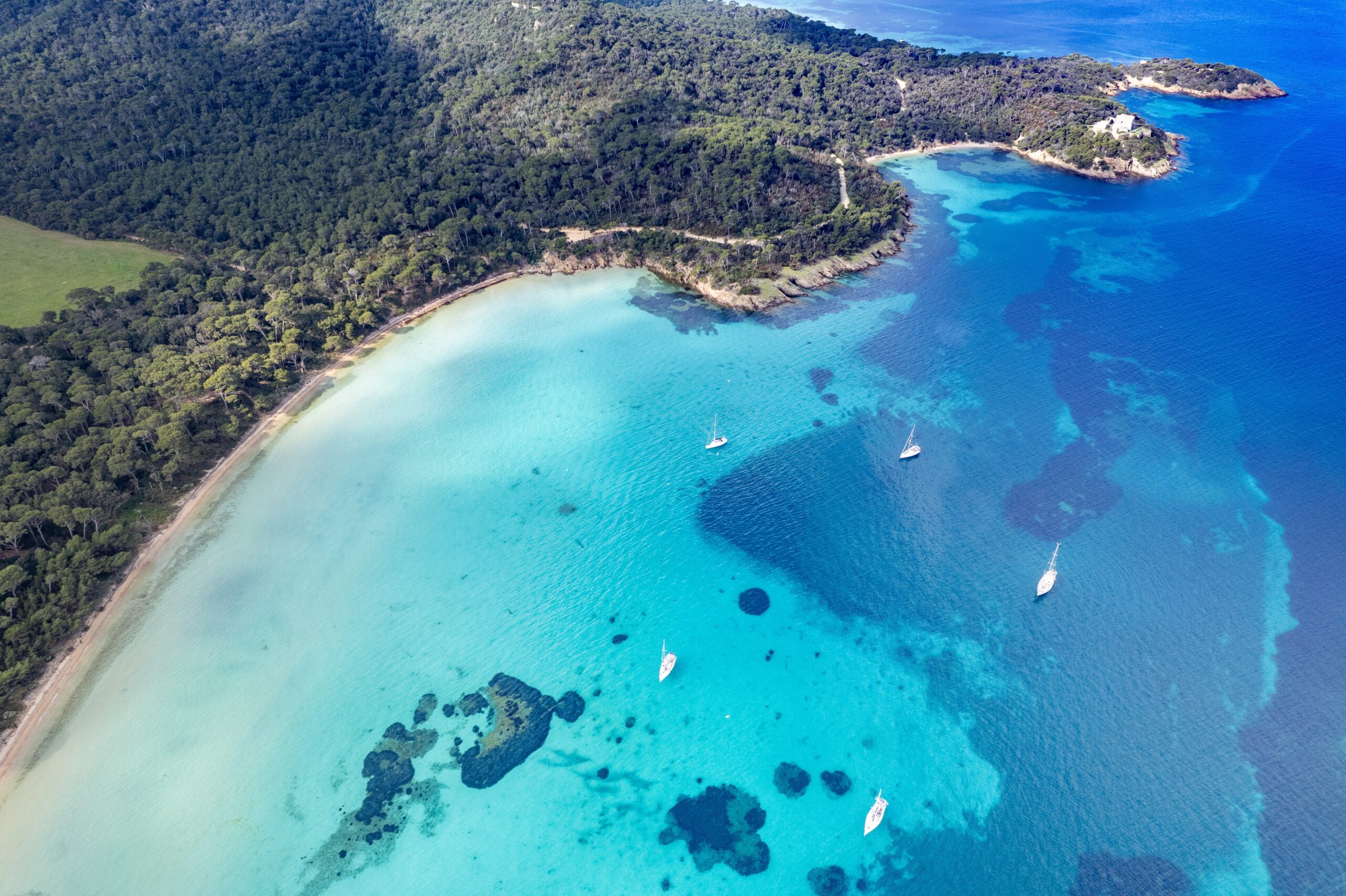 Aerial,View,Of,Sailing,Boats,Anchored,In,The,Sandy,Bay